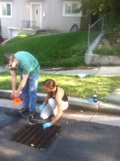 Ridley and Mallory taking a ground water sample