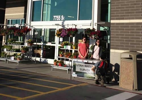 Viviane, Reva, and Matt taking down a table outside of Harmon's in the Salt Lake area on Thursday. 