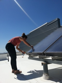 On the roof of the Geology Building at the University of Utah creating a fake rain event over a solar panel roof surface