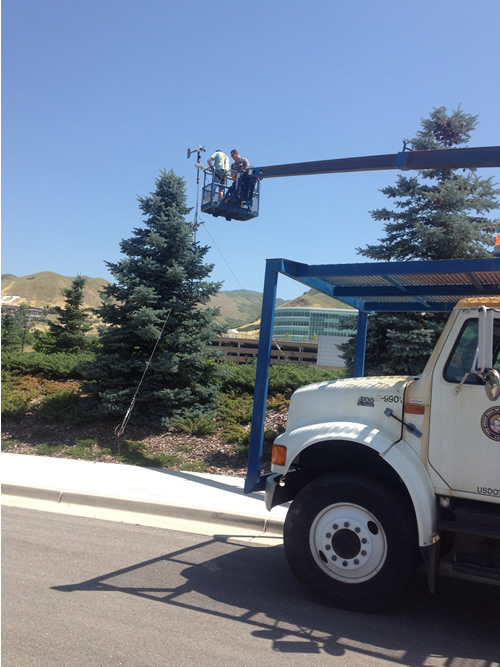 Using the bucket truck to install the instruments