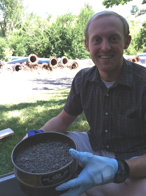 Homogenizing and sieving the soil outside the Water Lab's greenhouse 